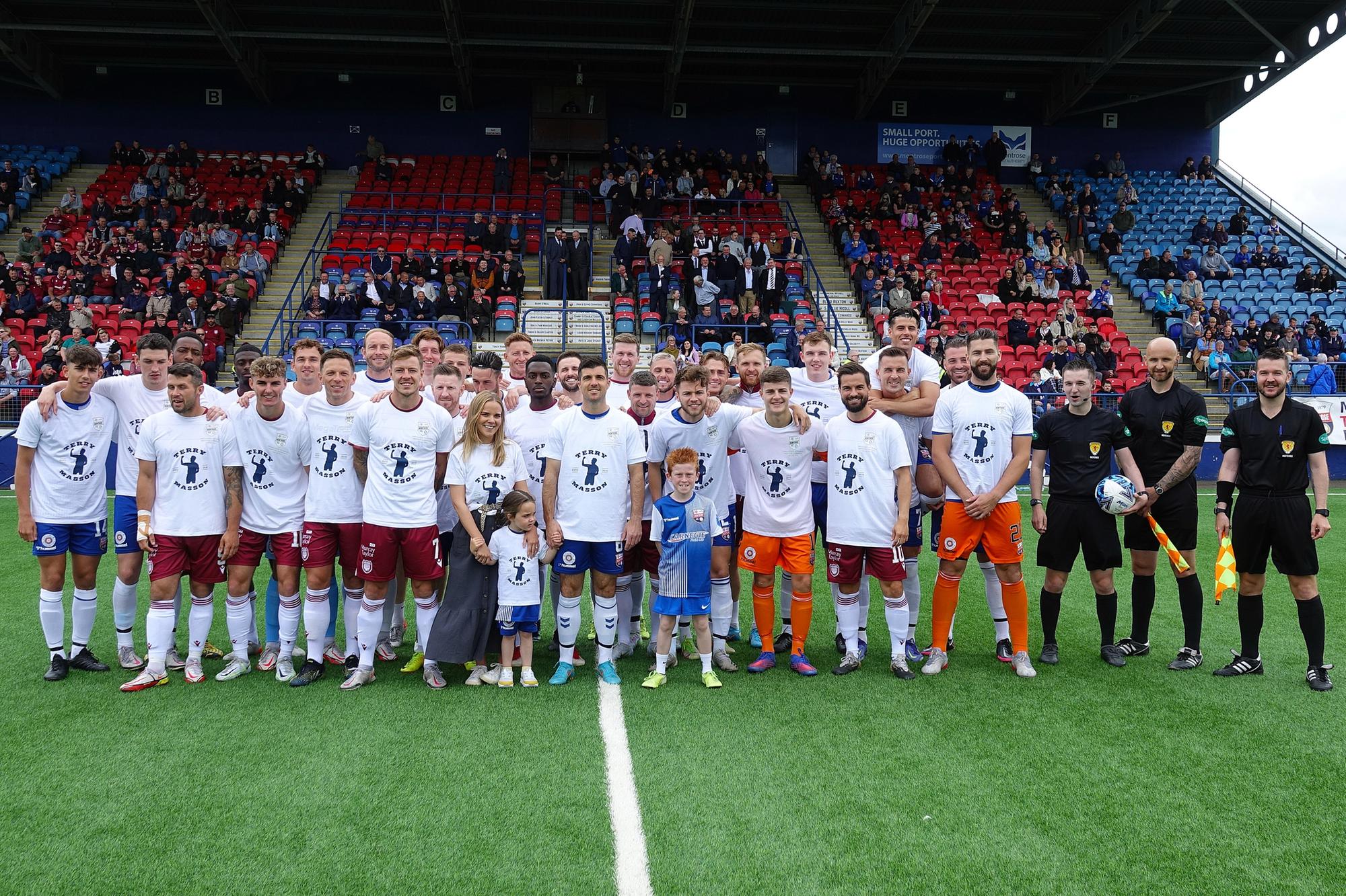 Both Montrose fc & Arbroath teams join together wearing a testimonial Terry Masson t-shirt  before kick off..jpg